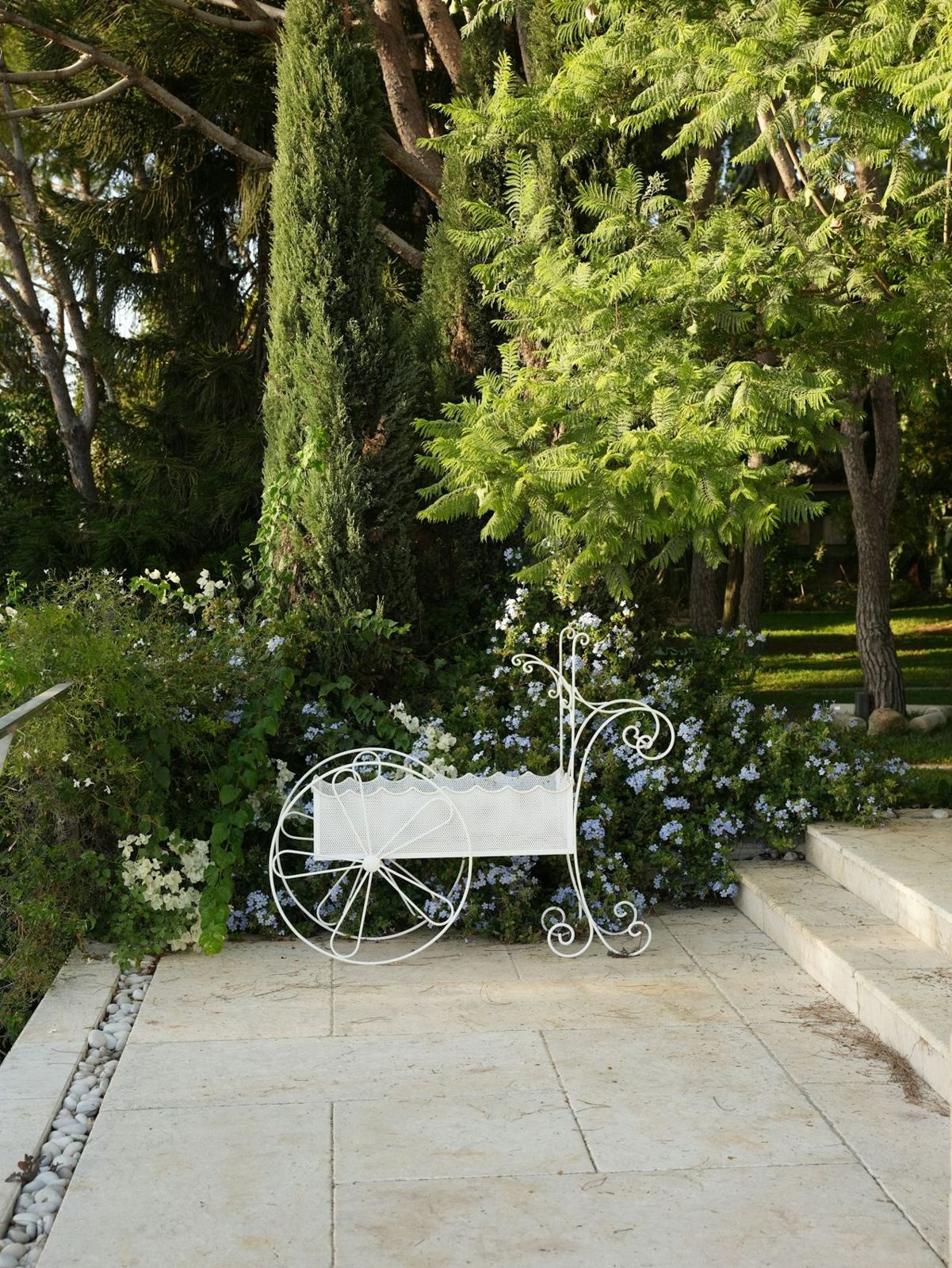 Light stone patio and steps in a garden